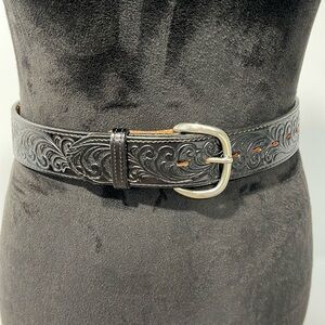 Justin top grain cowhide tooled leather belt back 34” long and 1.5 wide